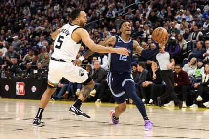 Jan 27, 2023; Minneapolis, Minnesota, USA; Memphis Grizzlies guard Ja Morant (12) drives to the basket while Minnesota Timberwolves forward Kyle Anderson (5) defends during the fourth quarter at Target Center. Mandatory Credit: Matt Krohn-USA TODAY Sports