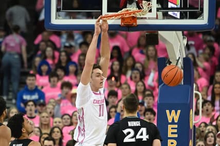 Jan 28, 2023; Omaha, Nebraska, USA;  Creighton Bluejays center Ryan Kalkbrenner (11) dunks over Xavier Musketeers forward Jack Nunge (24) in the first half at CHI Health Center Omaha. Mandatory Credit: Steven Branscombe-USA TODAY Sports