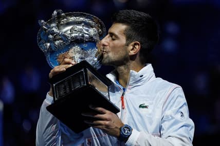 Jan 29, 2023; Melbourne, Victoria, Australia; Novak Djokovic of Serbia poses with the trophy after beating Stefanos Tsitsipas of Greece in the men's final on day fourteen of the 2023 Australian Open tennis tournament at Melbourne Park. Mandatory Credit: Mike Frey-USA TODAY Sports