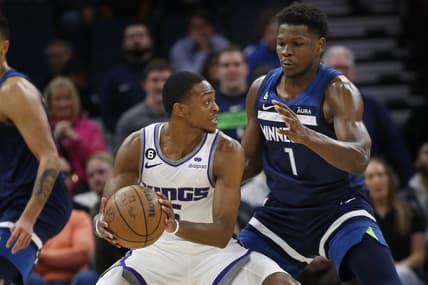 Jan 30, 2023; Minneapolis, Minnesota, USA; Sacramento Kings guard De'Aaron Fox (5) tries to work around Minnesota Timberwolves forward Anthony Edwards (1) in the fourth quarter at Target Center. Mandatory Credit: Bruce Kluckhohn-USA TODAY Sports