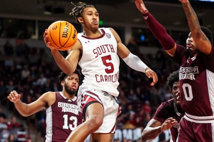 Jan 31, 2023; Columbia, South Carolina, USA; South Carolina Gamecocks guard Meechie Johnson (5) passes around Mississippi State Bulldogs forward D.J. Jeffries (0) in the first half at Colonial Life Arena. Mandatory Credit: Jeff Blake-USA TODAY Sports