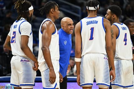Jan 31, 2023; Chicago, Illinois, USA; DePaul Blue Demons head coach Tony Stubblefield (center) talks to forward Da'Sean Nelson (21), forward Eral Penn (11), forward Javan Johnson (1) and guard K.T. Raimey (4) during a timeout in the first half against the Connecticut Huskies at Wintrust Arena. Mandatory Credit: Jamie Sabau-USA TODAY Sports