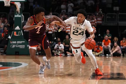 Jan 31, 2023; Coral Gables, Florida, USA; Miami Hurricanes guard Nijel Pack (24) drives the ball around Virginia Tech Hokies guard Michael Collins Jr. (2) during the second half at Watsco Center. Mandatory Credit: Jasen Vinlove-USA TODAY Sports