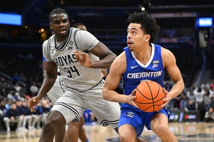 Feb 1, 2023; Washington, District of Columbia, USA; Creighton Bluejays guard Ryan Nembhard (2) prepares to shoot as Georgetown Hoyas center Qudus Wahab (34) defends during the first half at Capital One Arena. Mandatory Credit: Brad Mills-USA TODAY Sports