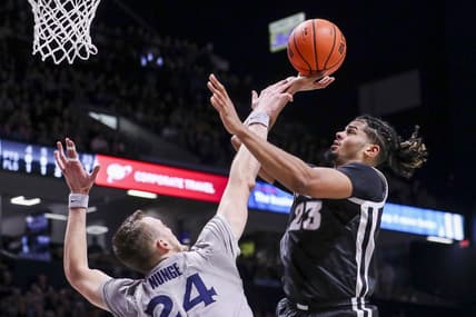 Feb 1, 2023; Cincinnati, Ohio, USA; Providence Friars forward Bryce Hopkins (23) shoots against Xavier Musketeers forward Jack Nunge (24) in the first half at Cintas Center. Mandatory Credit: Katie Stratman-USA TODAY Sports