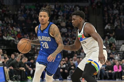 Feb 3, 2023; Minneapolis, Minnesota, USA; Orlando Magic guard Markelle Fultz (20) is defended by Minnesota Timberwolves guard Anthony Edwards (1) during the first quarter at Target Center. Mandatory Credit: Jeffrey Becker-USA TODAY Sports