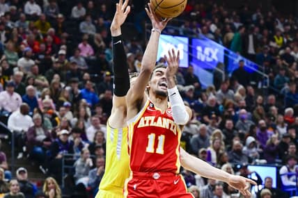 Feb 3, 2023; Salt Lake City, Utah, USA; Atlanta Hawks guard Trae Young (11) takes a shot around Utah Jazz forward/center Lauri Markkanen (23) during the first half at Vivint Arena. Mandatory Credit: Christopher Creveling-USA TODAY Sports