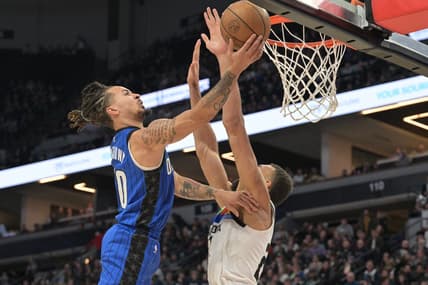 Feb 3, 2023; Minneapolis, Minnesota, USA; Orlando Magic guard Cole Anthony (50) goes to the basket as Minnesota Timberwolves center Rudy Gobert (27) defends during the second quarter at Target Center. Mandatory Credit: Jeffrey Becker-USA TODAY Sports