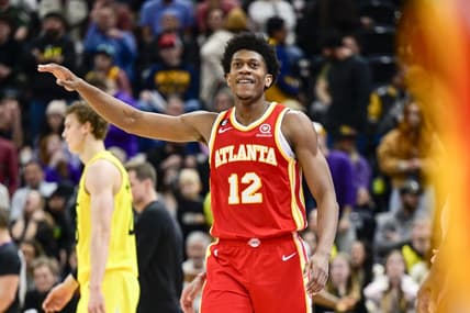 Feb 3, 2023; Salt Lake City, Utah, USA; Atlanta Hawks forward/guard De'Andre Hunter (12) reacts after making a three point basket against the Utah Jazz during the second half at Vivint Arena. Mandatory Credit: Christopher Creveling-USA TODAY Sports
