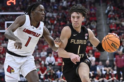 Feb 4, 2023; Louisville, Kentucky, USA;  Florida State Seminoles guard Jalen Warley (1) dribbles against Louisville Cardinals guard Mike James (1) during the first half at KFC Yum! Center. Mandatory Credit: Jamie Rhodes-USA TODAY Sports