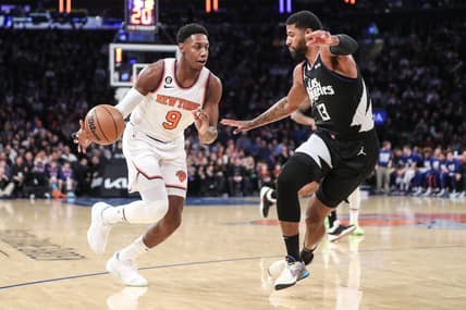 Feb 4, 2023; New York, New York, USA;  New York Knicks guard RJ Barrett (9) looks to drive past LA Clippers guard Paul George (13) in the first quarter at Madison Square Garden. Mandatory Credit: Wendell Cruz-USA TODAY Sports