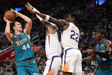 Feb 4, 2023; Detroit, Michigan, USA;  Detroit Pistons forward Bojan Bogdanovic (44) controls the ball against Phoenix Suns forward Torey Craig (middle) and center Deandre Ayton (22) in the first quarter at Little Caesars Arena. Mandatory Credit: Lon Horwedel-USA TODAY Sports