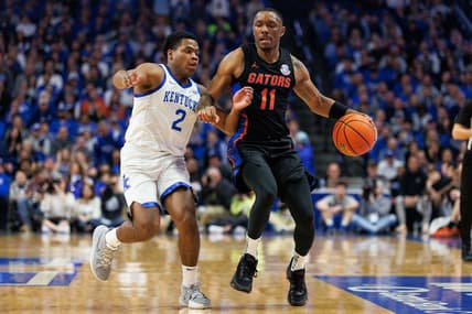 Feb 4, 2023; Lexington, Kentucky, USA; Florida Gators guard Kyle Lofton (11) brings the ball up court against Kentucky Wildcats guard Sahvir Wheeler (2) during the first half at Rupp Arena at Central Bank Center. Mandatory Credit: Jordan Prather-USA TODAY Sports