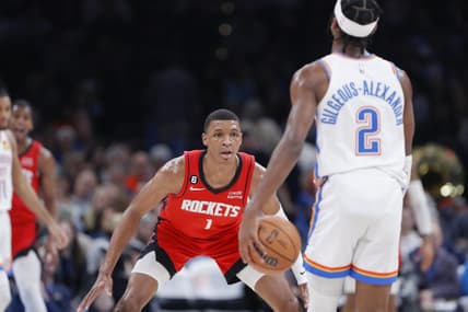 Feb 4, 2023; Oklahoma City, Oklahoma, USA; Houston Rockets forward Jabari Smith Jr. (1) defends Oklahoma City Thunder guard Shai Gilgeous-Alexander (2) during the second quarter at Paycom Center. Mandatory Credit: Alonzo Adams-USA TODAY Sports