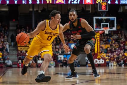 Feb 4, 2023; Minneapolis, Minnesota, USA; Minnesota Golden Gophers guard Taurus Samuels (0) dribbles on Maryland Terrapins guard Don Carey (0) in the first half at Williams Arena. Mandatory Credit: Matt Blewett-USA TODAY Sports