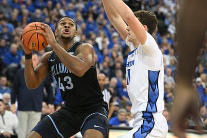 Feb 4, 2023; Omaha, Nebraska, USA; Villanova Wildcats forward Eric Dixon (43) drives against Creighton Bluejays center Ryan Kalkbrenner (11) in the first half at CHI Health Center Omaha. Mandatory Credit: Steven Branscombe-USA TODAY Sports