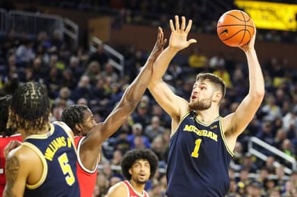 Michigan center Hunter Dickinson (1) goes to the basket against Ohio State during the second half at Crisler Center in Ann Arbor on Sunday, Feb. 5, 2023.