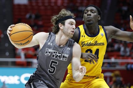 Feb 5, 2023; Salt Lake City, Utah, USA; Utah Utes guard Jaxon Brenchley (5) drives against California Golden Bears forward Sam Alajiki (24) in the second half at Jon M. Huntsman Center. Mandatory Credit: Jeffrey Swinger-USA TODAY Sports