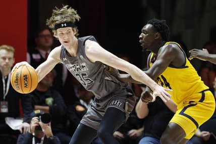 Feb 5, 2023; Salt Lake City, Utah, USA; Utah Utes center Branden Carlson (35) looks to drive against California Golden Bears forward Sam Alajiki (24) in the first half at Jon M. Huntsman Center. Mandatory Credit: Jeffrey Swinger-USA TODAY Sports