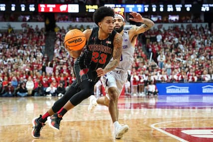 Feb 5, 2023; Madison, Wisconsin, USA; Wisconsin Badgers guard Chucky Hepburn (23) drives to the basket while defended by Northwestern Wildcats guard Boo Buie (0) during the second half at the Kohl Center. Mandatory Credit: Kayla Wolf-USA TODAY Sports