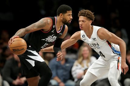 Feb 6, 2023; Brooklyn, New York, USA; Los Angeles Clippers guard Paul George (13) controls the ball against Brooklyn Nets forward Kessler Edwards (14) during the second quarter at Barclays Center. Mandatory Credit: Brad Penner-USA TODAY Sports
