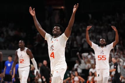 Feb 6, 2023; Coral Gables, Florida, USA; Miami Hurricanes guard Bensley Joseph (4), center Favour Aire (12) and guard Wooga Poplar (55) celebrate after defeating the Duke Blue Devils at Watsco Center. Mandatory Credit: Jasen Vinlove-USA TODAY Sports