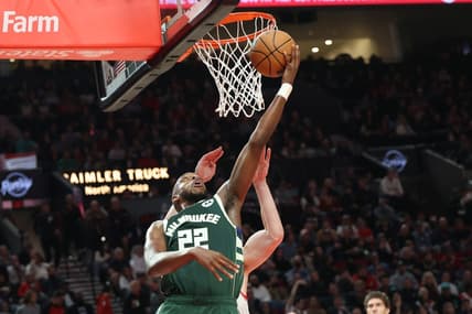 Feb 6, 2023; Portland, Oregon, USA; Milwaukee Bucks forward Khris Middleton (22) scores over Portland Trail Blazers in the first half at Moda Center. Mandatory Credit: Jaime Valdez-USA TODAY Sports