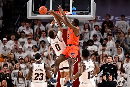 Feb 7, 2023; College Station, Texas, USA; Auburn Tigers guard Allen Flanigan (22) blocks Texas A&M Aggies guard Dexter Dennis (0) during the first half at Reed Arena. Mandatory Credit: Maria Lysaker-USA TODAY Sports