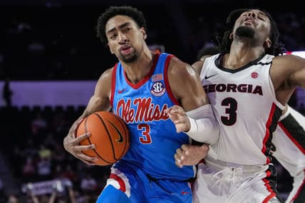 Feb 7, 2023; Athens, Georgia, USA; Mississippi Rebels forward Myles Burns (3) is called for a charging foul against Georgia Bulldogs guard Kario Oquendo (3) during the first half at Stegeman Coliseum. Mandatory Credit: Dale Zanine-USA TODAY Sports