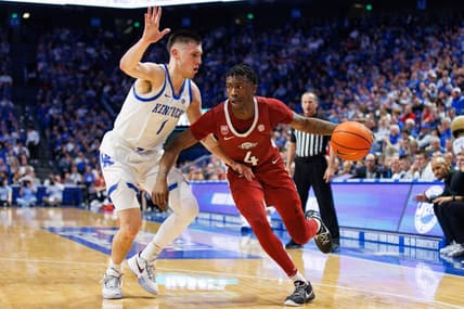 Feb 7, 2023; Lexington, Kentucky, USA; Arkansas Razorbacks guard Davonte Davis (4) drives to the basket around Kentucky Wildcats guard CJ Fredrick (1) during the first half at Rupp Arena at Central Bank Center. Mandatory Credit: Jordan Prather-USA TODAY Sports