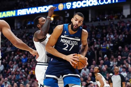 Feb 7, 2023; Denver, Colorado, USA; Minnesota Timberwolves center Rudy Gobert (27) pulls a rebound in away from Denver Nuggets forward Jeff Green (32) in the second quarter at Ball Arena. Mandatory Credit: Ron Chenoy-USA TODAY Sports