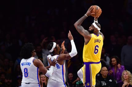 Feb 7, 2023; Los Angeles, California, USA; Los Angeles Lakers forward LeBron James (6) shoots against Oklahoma City Thunder guard Shai Gilgeous-Alexander (2) in the first quarter at Crypto.com Arena. Mandatory Credit: Gary A. Vasquez-USA TODAY Sports