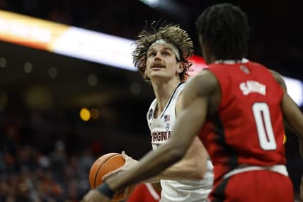 Feb 7, 2023; Charlottesville, Virginia, USA; Virginia Cavaliers forward Ben Vander Plas (5) prepares tp shoot the ball as North Carolina State Wolfpack guard Terquavion Smith (0) defends in the second half at John Paul Jones Arena. Mandatory Credit: Geoff Burke-USA TODAY Sports