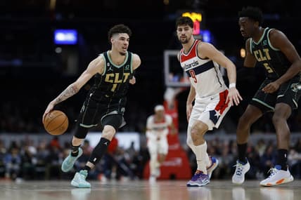 Feb 8, 2023; Washington, District of Columbia, USA; Charlotte Hornets guard LaMelo Ball (1) dribbles the ball as Washington Wizards forward Deni Avdija (9) defends in the second quarter at Capital One Arena. Mandatory Credit: Geoff Burke-USA TODAY Sports