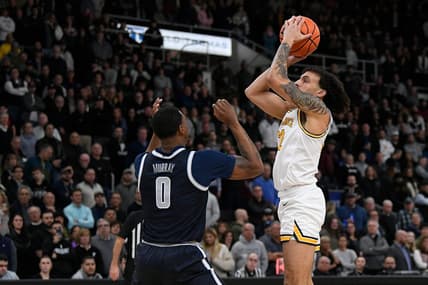Feb 8, 2023; Providence, Rhode Island, USA; Providence Friars guard Devin Carter (22) shoots in front of Georgetown Hoyas guard Brandon Murray (0) during the first half at Amica Mutual Pavilion. Mandatory Credit: Eric Canha-USA TODAY Sports