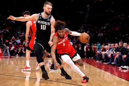 Feb 8, 2023; Houston, Texas, USA; Houston Rockets guard Jalen Green (4) handles the ball against Sacramento Kings forward Domantas Sabonis (10) during the first quarter at Toyota Center. Mandatory Credit: Erik Williams-USA TODAY Sports