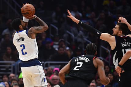 Feb 8, 2023; Los Angeles, California, USA; Dallas Mavericks guard Kyrie Irving (2) shoots against Los Angeles Clippers center Ivica Zubac (40) during the first half at Crypto.com Arena. Mandatory Credit: Gary A. Vasquez-USA TODAY Sports