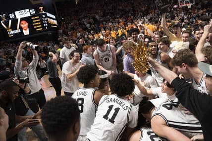 Feb 8, 2023; Nashville, Tennessee, USA;   Vanderbilt Commodores players and students celebrate after defeating the Tennessee Volunteers 66 to 65 at Memorial Gymnasium.  Mandatory Credit: George Walker IV - USA TODAY Sports