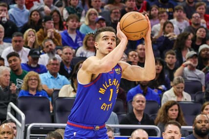 Feb 9, 2023; Orlando, Florida, USA; Denver Nuggets forward Michael Porter Jr. (1) shoots a three point basket against the Orlando Magic during the first quarter at Amway Center. Mandatory Credit: Mike Watters-USA TODAY Sports