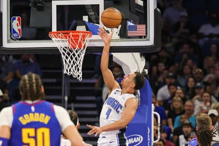 Feb 9, 2023; Orlando, Florida, USA; Orlando Magic guard Jalen Suggs (4) goes to the basket during the first quarter against the Denver Nuggets at Amway Center. Mandatory Credit: Mike Watters-USA TODAY Sports