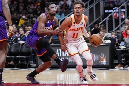 Feb 9, 2023; Atlanta, Georgia, USA; Atlanta Hawks guard Trae Young (11) works against Phoenix Suns forward Josh Okogie (2) during the first half at State Farm Arena. Mandatory Credit: Dale Zanine-USA TODAY Sports
