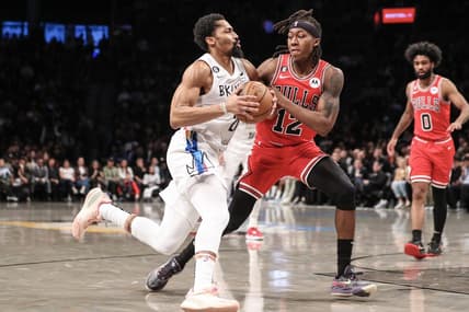 Feb 9, 2023; Brooklyn, New York, USA;  Brooklyn Nets guard Spencer Dinwiddie (26) looks to drive past Chicago Bulls guard Ayo Dosunmu (12) in the second quarter at Barclays Center. Mandatory Credit: Wendell Cruz-USA TODAY Sports