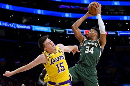 Feb 9, 2023; Los Angeles, California, USA;  Los Angeles Lakers guard Austin Reaves (15) defends Milwaukee Bucks forward Giannis Antetokounmpo (34) as he drives to the basket in the first half at Crypto.com Arena. Mandatory Credit: Jayne Kamin-Oncea-USA TODAY Sports