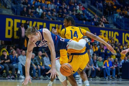 Feb 9, 2023; Berkeley, California, USA; Arizona Wildcats forward Azuolas Tubelis (10) is upended fouled by California Golden Bears forward Grant Newell (14) during the first half at Haas Pavilion. Mandatory Credit: Neville E. Guard-USA TODAY Sports