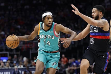 Feb 10, 2023; Detroit, Michigan, USA;  San Antonio Spurs guard Blake Wesley (14) dribbles on Detroit Pistons guard Cory Joseph (18) in the first half at Little Caesars Arena. Mandatory Credit: Rick Osentoski-USA TODAY Sports