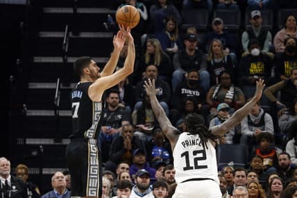 Feb 10, 2023; Memphis, Tennessee, USA; Memphis Grizzlies forward Santi Aldama (7) shoots for three as Minnesota Timberwolves forward Taurean Prince (12) defends during the first half at FedExForum. Mandatory Credit: Petre Thomas-USA TODAY Sports