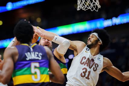 Feb 10, 2023; New Orleans, Louisiana, USA; New Orleans Pelicans center Jonas Valanciunas (17) gets hit in the face by Cleveland Cavaliers center Jarrett Allen (31) during the fourth quarter at Smoothie King Center. Mandatory Credit: Andrew Wevers-USA TODAY Sports