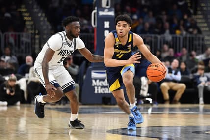 Feb 11, 2023; Washington, District of Columbia, USA; Marquette Golden Eagles guard Stevie Mitchell (4) dribbles as Georgetown Hoyas guard Jay Heath (5) defends during the second half at Capital One Arena. Mandatory Credit: Brad Mills-USA TODAY Sports