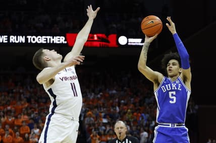 Feb 11, 2023; Charlottesville, Virginia, USA; Duke Blue Devils guard Tyrese Proctor (5) shoots the ball as Virginia Cavaliers guard Isaac McKneely (11) defends in the first half at John Paul Jones Arena. Mandatory Credit: Geoff Burke-USA TODAY Sports