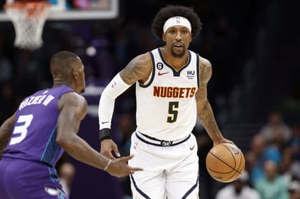 Feb 11, 2023; Charlotte, North Carolina, USA; Denver Nuggets guard Kentavious Caldwell-Pope (5) controls the ball against Charlotte Hornets guard Terry Rozier (3) in the first quarter at Spectrum Center. Mandatory Credit: Brian Westerholt-USA TODAY Sports